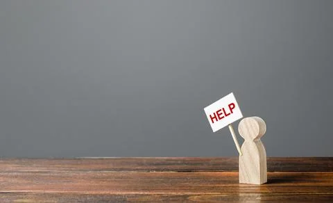 A human figurine asking for help. Support and assistance, providing funding.. Stock Photos