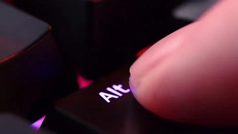 Human finger is clicking on the Alt button on the computer keyboard, close .. Stock Footage 234792771