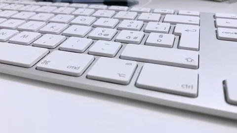 Human finger clicking the Enter button on a white computer keyboard Stock Footage 120745217
