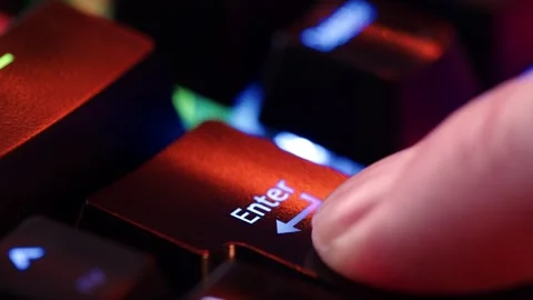 Human finger is clicking on the Enter button on the computer keyboard, clos.. Stock Footage 262736809