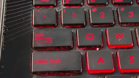 Human finger interacting with backlit keyboard in "tab" button, Stockbeeldmateriaal 332938727