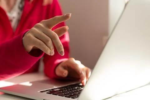 Human finger pointing on the glowing computer screen Stock Photos