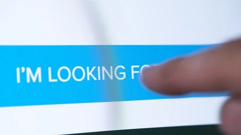 Human finger presses on screen button looking for job, close-up Stockbeeldmateriaal 128797754