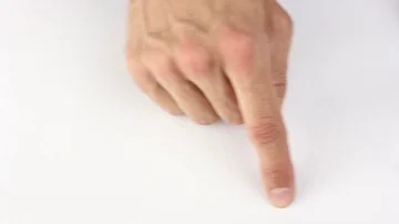 Human finger traces the outline of the rectangle on white table Video stock 85508763