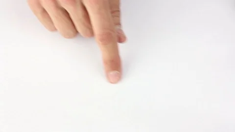 Human finger traces the outline of the small circle on white table Stock-Footage 85508773