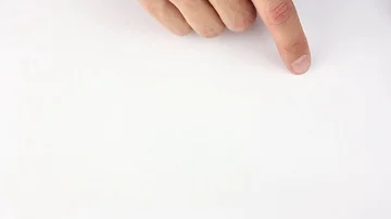 Human finger traces the outline of the triangle on white table Stockbeeldmateriaal 85508762