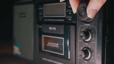Human Fingers Adjusting Control Knob on Vintage Radio Cassette Player 스톡 동영상 332663257