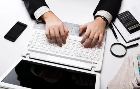 Human fingers on the notebook keyboard Stock Photos