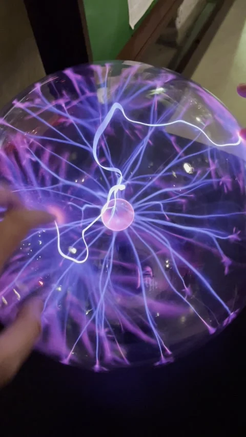 Human fingers touching a glowing plasma ball with electric lightning Stock Footage 338403919