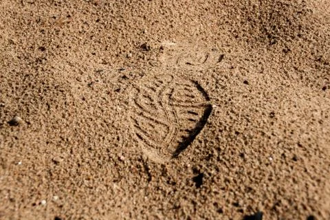 Human footmarks on sand. Stock Photos