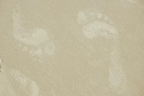 Human footprints in the sand. Texture background Footprints of human feet o.. Stock-Fotos