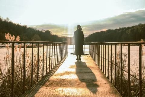 Human in gas mask standing dramatic sky background. Enviromental pollution Stock Photos