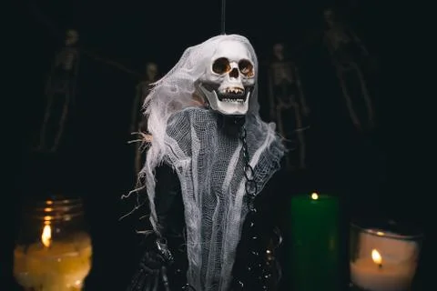 Human ghost in the guise of a skeleton in chains on a black background Stock Photos