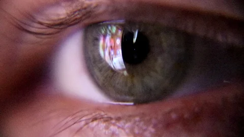 Human green eye looking at screen of smartphone. HD Extreme Close Up Video stock 94181761