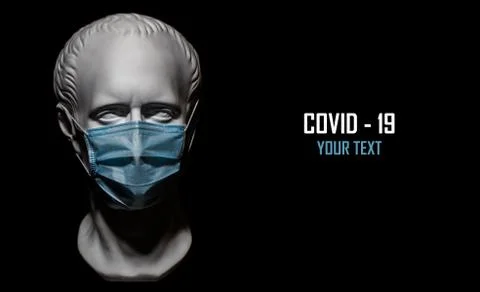 Human gypsum head in protective antiviral mask. Black background for text. Stock Photos