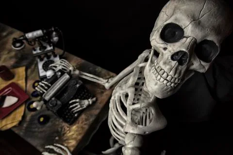 Human Halloween Skeleton at the table with typwriter Stock Photos