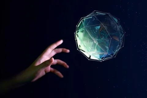 Human hand about to touch the earth globe, Earth Day concept Stock Photos