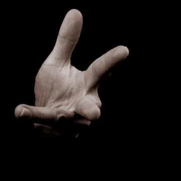 Human hand on black background counting on fingers Stock Photos