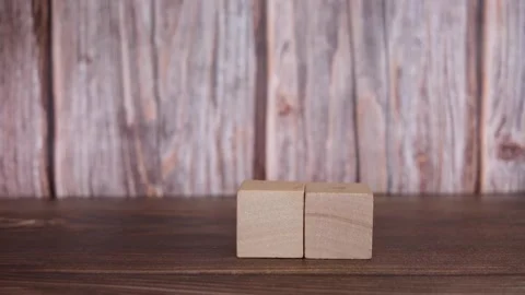 Human hand building or assembling a block pyramid. Stock Footage 263262026