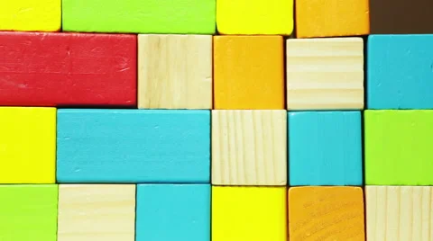 Human hand building wall from color wooden blocks Stock Footage 48750049