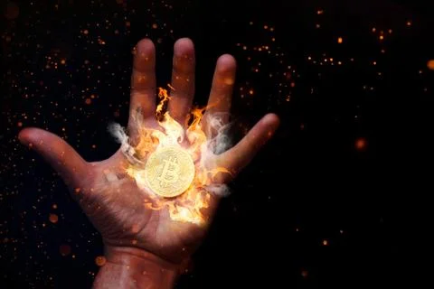 Human Hand Burning Bitcoin Stock Photos