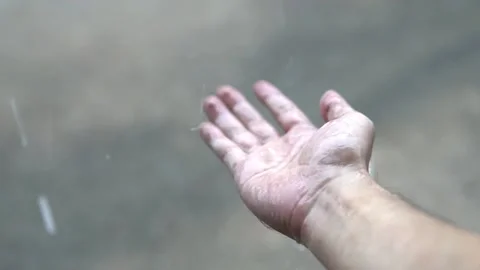 Human hand catching rain drops during rainy season.Video, play back Stock Footage 130773905