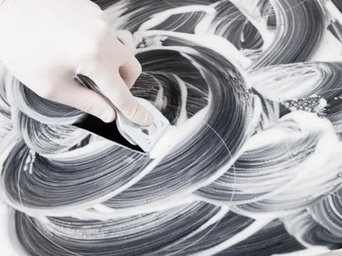 Human hand cleaning a vitroceramic Stock Photos