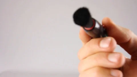 Human hand cleans camera lense with brush, first person view, from inside camera Video stock 103188297
