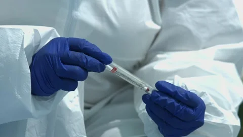 human hand collecting blood samples at t... | Stock Video | Pond5