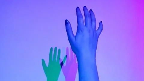 Human hand colored light shadow gradient background minimal studio Stockfoto's