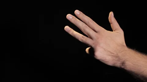Human hand counts numbers. Black background Stock Footage 119809398