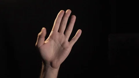 Human hand counts numbers. Black background Stock Footage 119809629