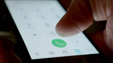Human hand Dials A Number On The Screen Of The Smartphone Stock Footage 147108392