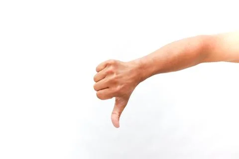 Human hand displaying thumb down against bright white backdrop studio shot Stock Photos