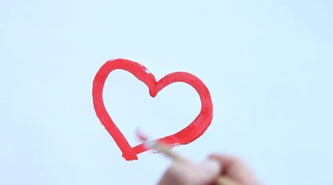 Human hand drawing heart with red gouache Stock Footage 40031833