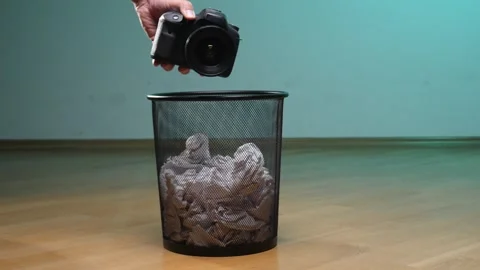 Human hand dropping an outdated professional digital single lens reflex camera Stock Footage 342768294