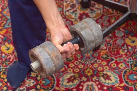 Human hand with dumbbell Stock Photos