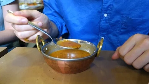 Human hand eating soup Stock Footage 75902668