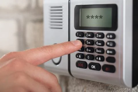 Human Hand Entering Security System Code 스톡 사진