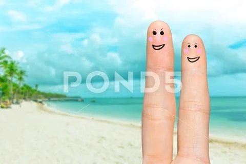 Human hand fingers with funny painted emoticons. People relationships concept Stock Photos