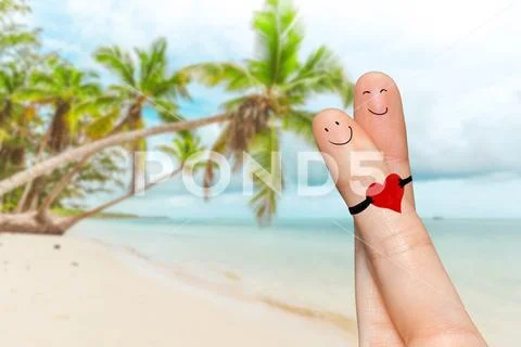 Human hand fingers with funny painted emoticons. People relationships concept Stock Photos
