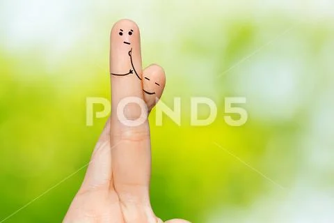 Human hand fingers with funny painted emoticons. People relationships concept Stock Photos