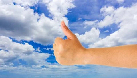 Human hand gesture something with sky background Stock Photos