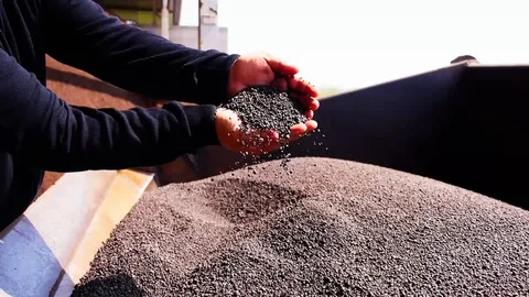 Human hand grabbing the raw material of fertilizer Stock Footage 121695981