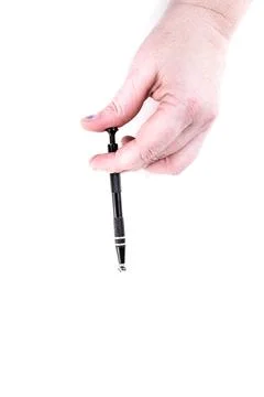 Human hand grasping a bead with a wire grabber tool Stock Photos