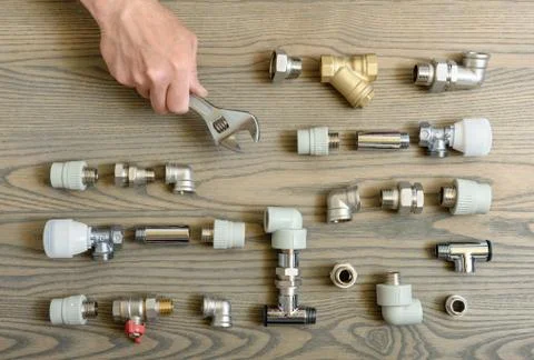 A human hand is holding the adjustable wrenches. Stock Photos