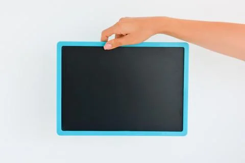Human hand holding an empty blackboard Stock Photos