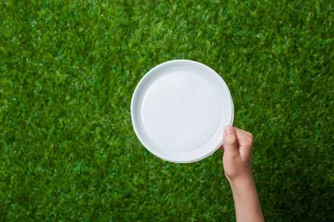 Human hand holding empty dish Stock Photos