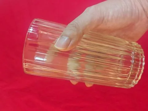 Human Hand Holding Empty Transparent Drinking Glass Cup Stock Photos