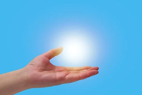Human hand holding glowing light flare 写真素材